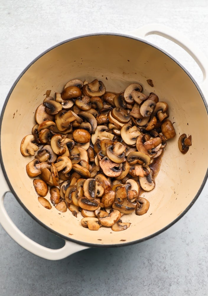 Large pot with cooked mushrooms