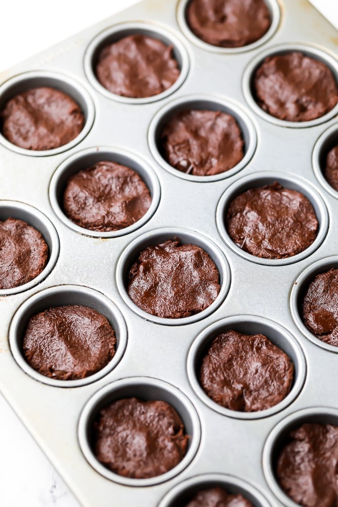 muffin pan filled with brownie batter