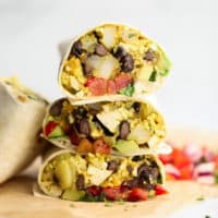 3 breakfast burritos cut in half and stacked on each other