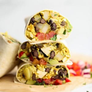 3 breakfast burritos cut in half and stacked on each other
