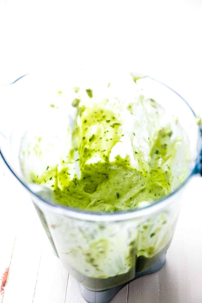 creamy green sauce in a blender
