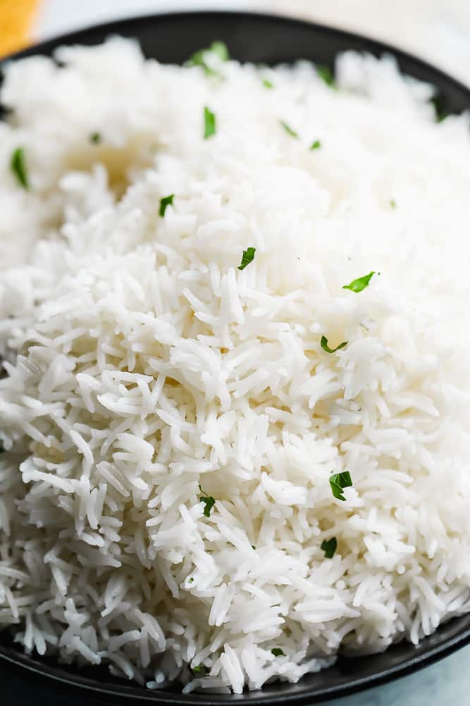 close up on a bowl full of cooked white basmati rice