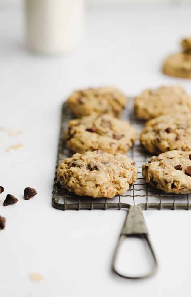 baked oatmeal chocolate chip cookies cooking on a cooling rack