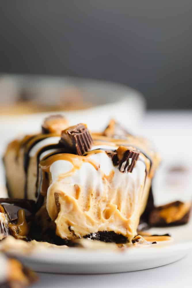 close up of a piece of peanut butter pie with a fork taking a bite, showing texture inside