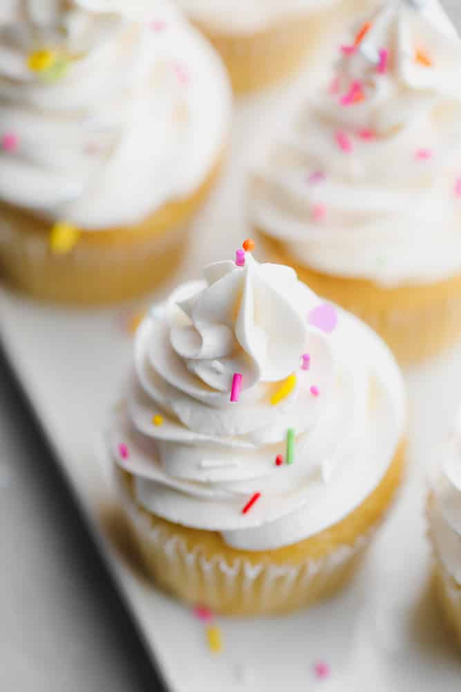 looking down on a couple of cupcakes with sprinkles