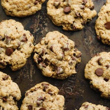 rows of baked oatmeal chocolate chip cookies on a baking sheet