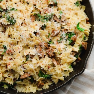 square image of pasta with spinach