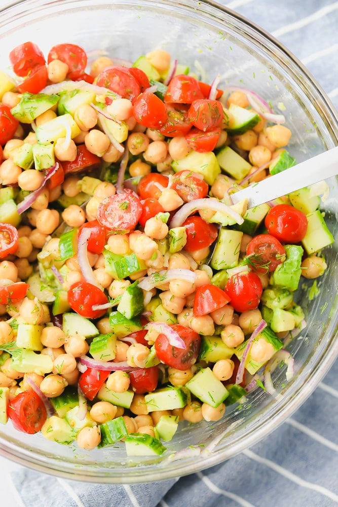 chickpea and tomato salad in a large glass bowl