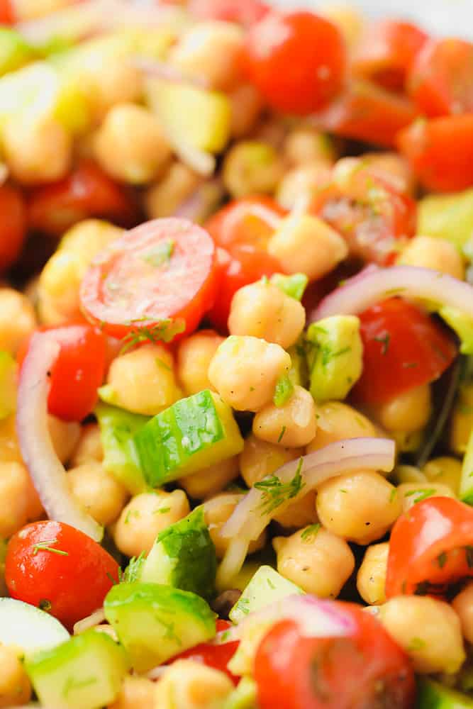 close up on a chickpea salad with tomatoes and cucumbers