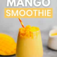 pinterest image of a yellow smoothie in a glass garnished with mango chunks and a yellow and red straw