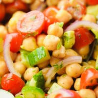 close up on a chickpea salad with tomatoes and cucumbers