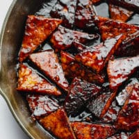 square image of marinated tempeh in pan