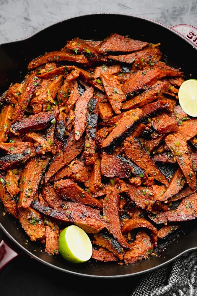 cast iron pan full of mock seitan meat that looks seasoned