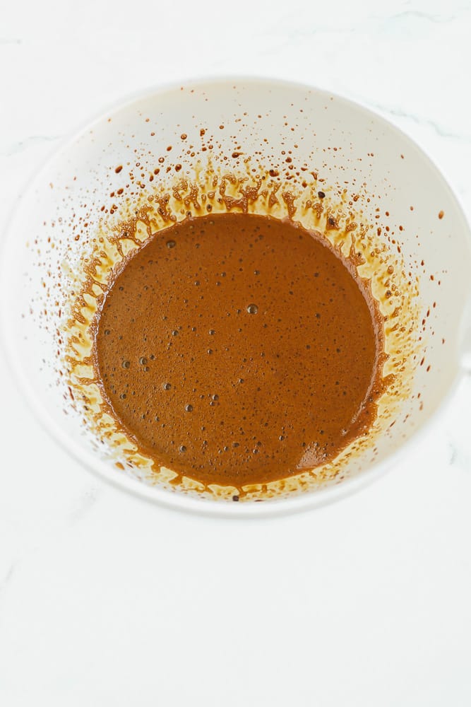 light brown liquid in a large white bowl