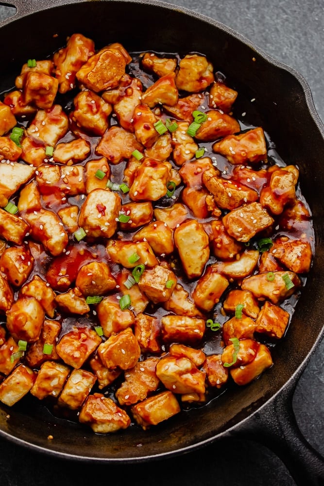 cooked tofu in a sauce in a large pan