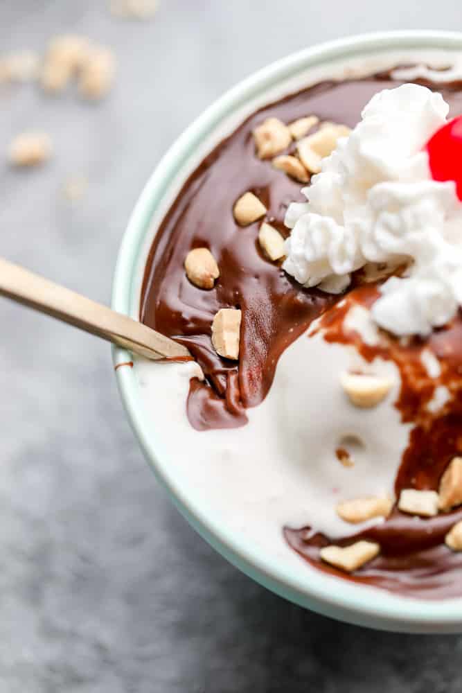 close up showing texture of thick fudge on ice cream