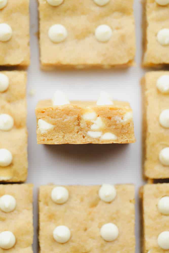 baked blondies with white chocolate chips cut into squares