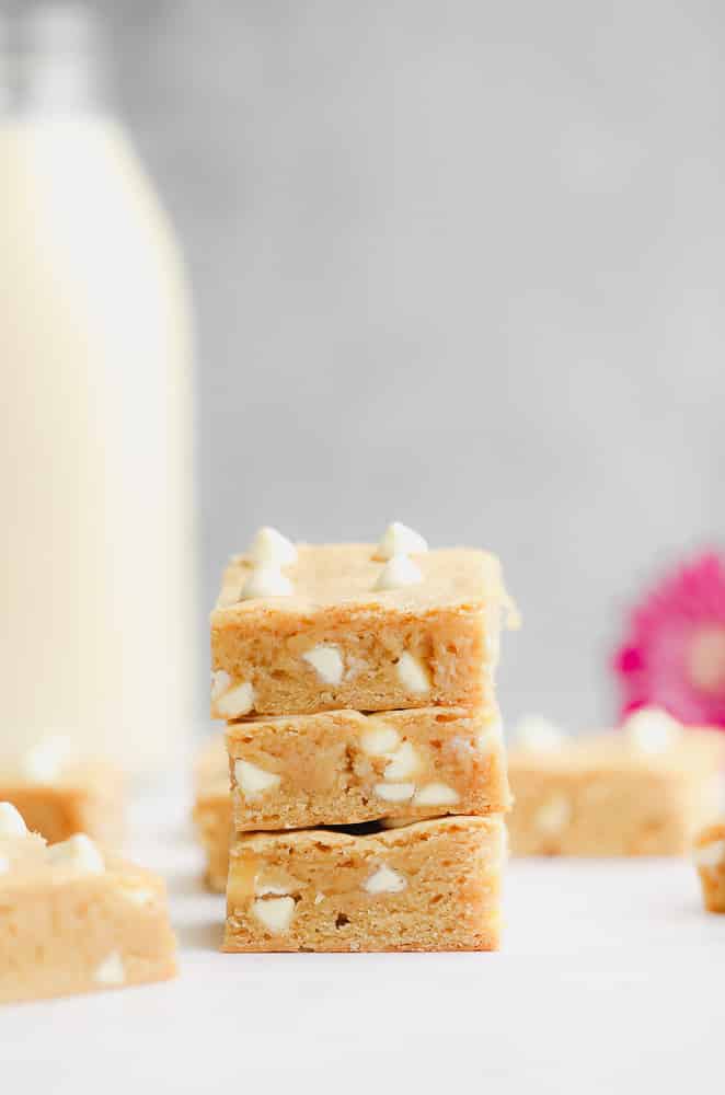 3 baked blondie squares piled on top of each other