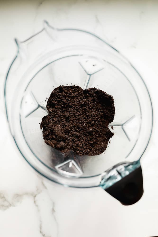 crumbled dark brown cookies in a blender