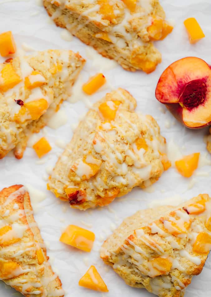 baked peach scones next to sliced and cubed peaches