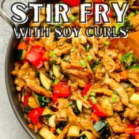pinterest image of a large skillet with cooked vegetable stir fry