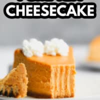 pinterest image of a slice of pumpkin cheesecake with a bite missing.