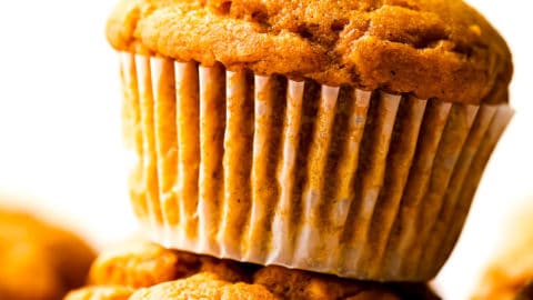 square image of muffin on top of another orange muffin
