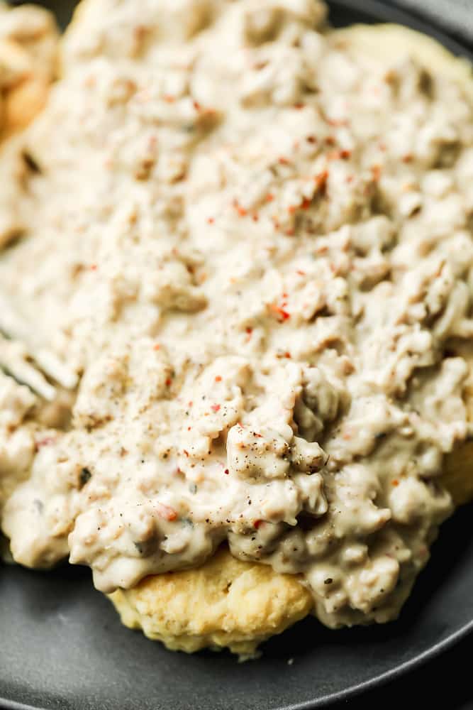 close up of a biscuit slathered in gravy