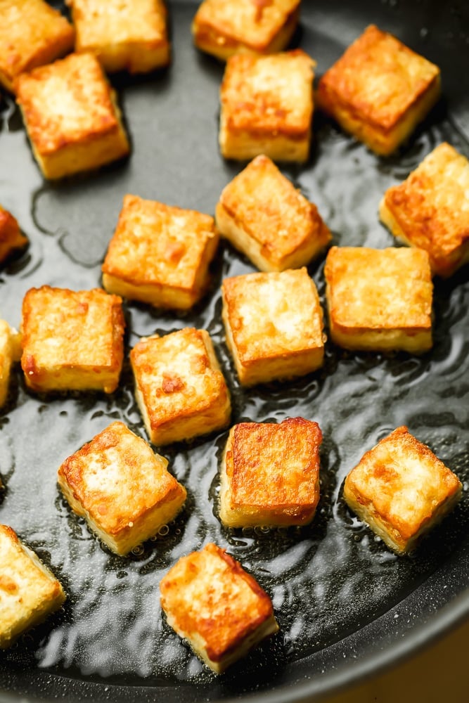 pan with tofu frying in it