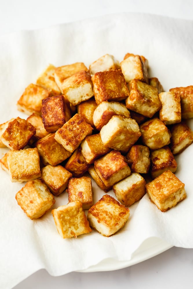 fried tofu on paper towels, draining