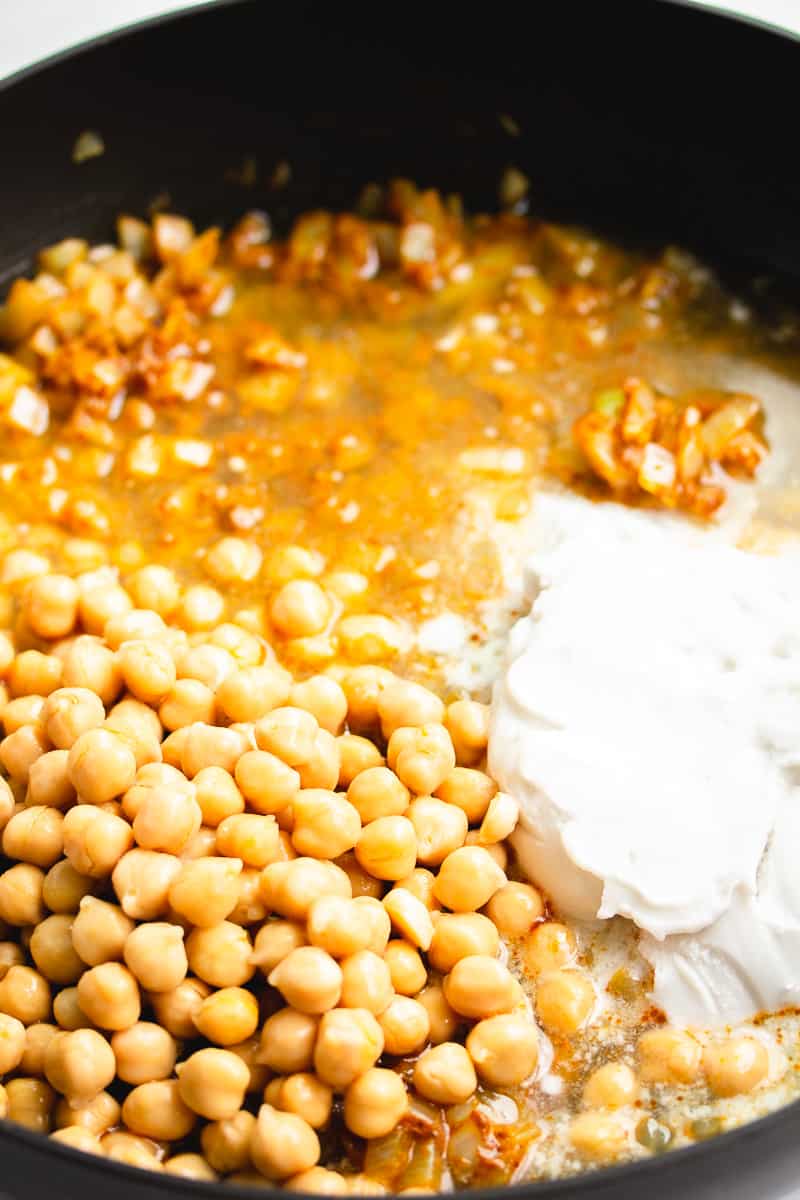 chickpeas, cream and other liquid in a pan