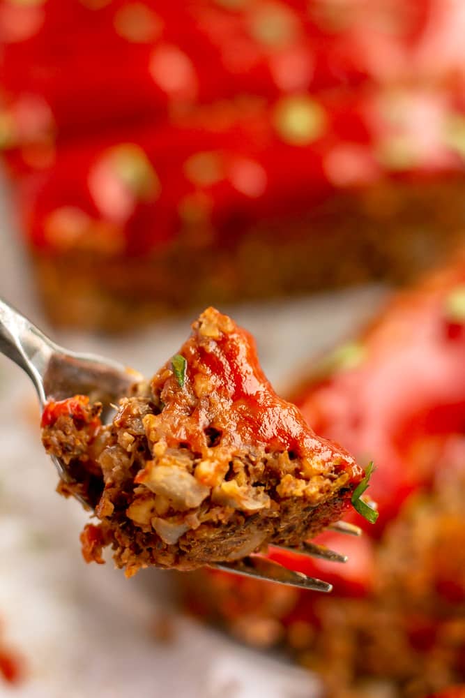 fork holding a bite of vegan meatloaf