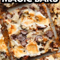 pinterest image of a cut cookie bar with toasted marshmallows, coconut, and chocolate on top.