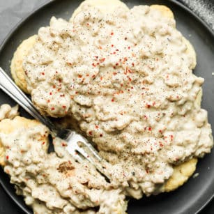 square image of a plate of biscuits with gravy topping