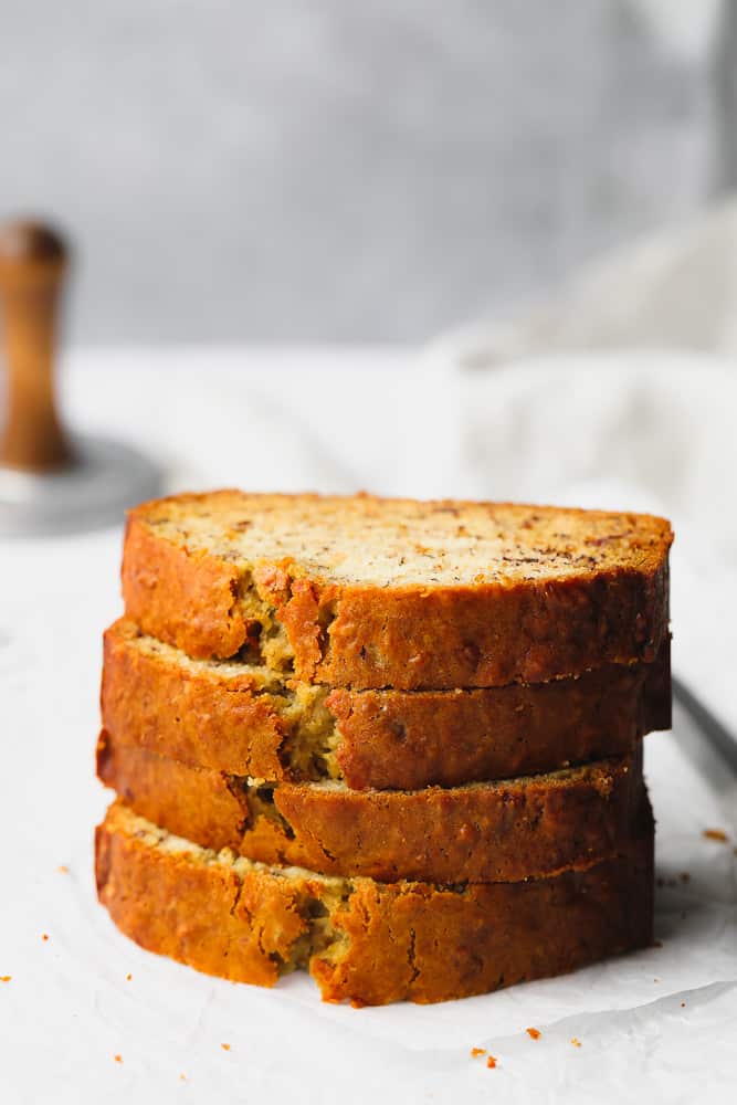 stack of 4 pieces of bread with grey and white background