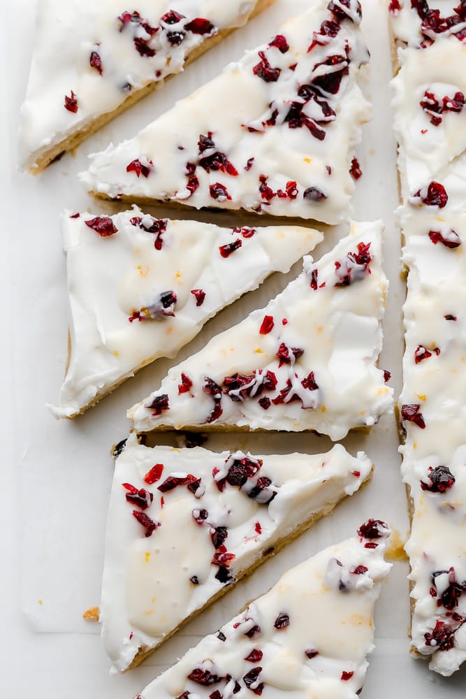 white chocolate and cranberry cookie bars cut into triangles.