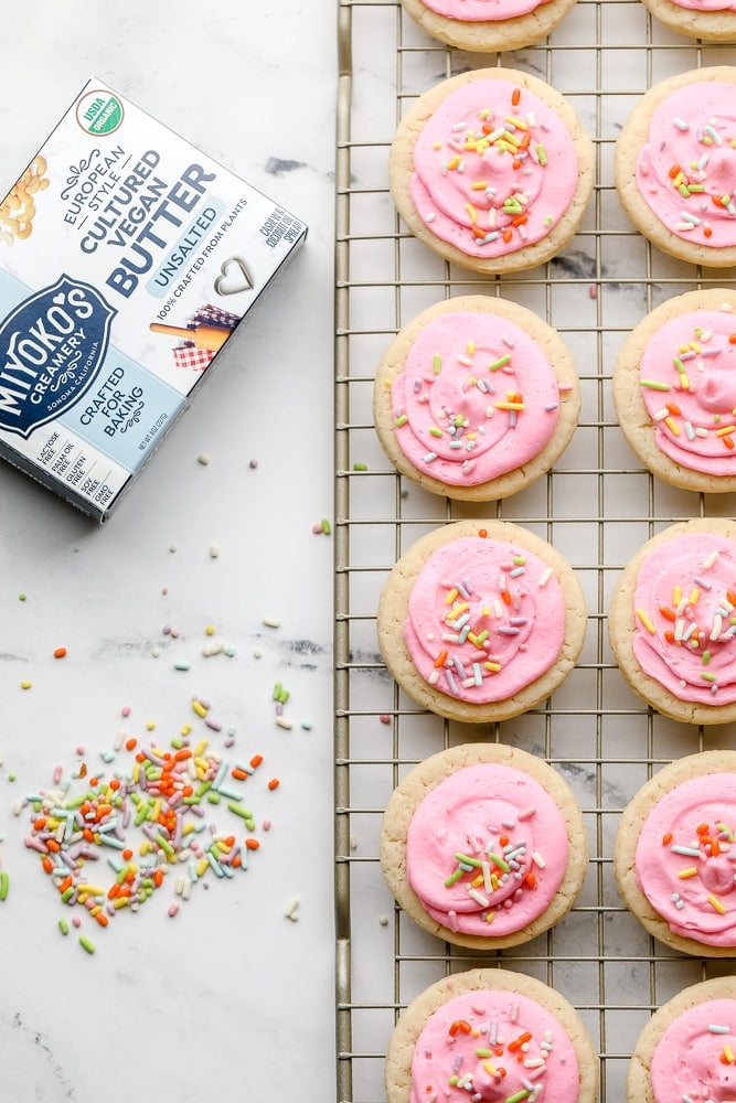 Miyokos butter with lots of cookies on a rack, frosted