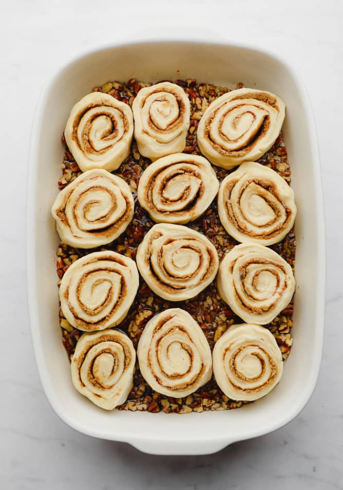 unbaked cinnamon rolls in casserole dish