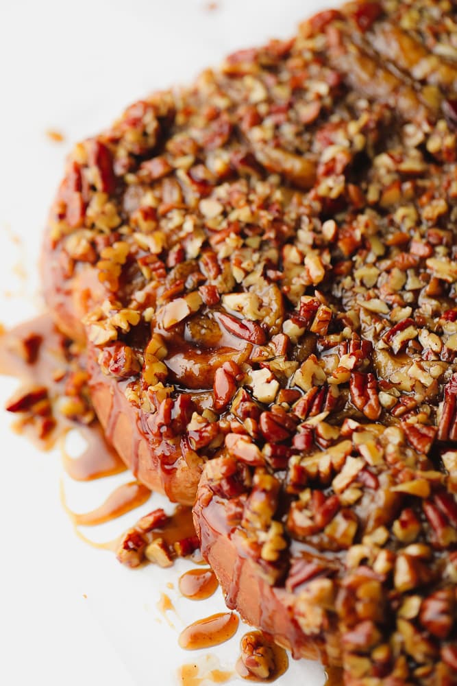 rolls on white background with caramel and pecans