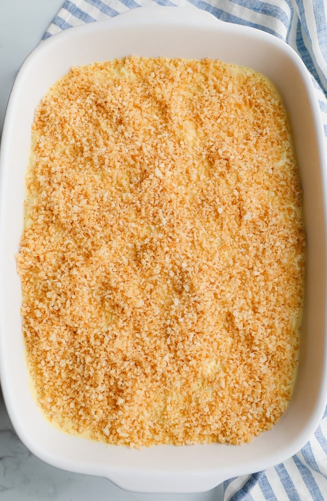 breadcrumbs covering mac and cheese in dish for baking