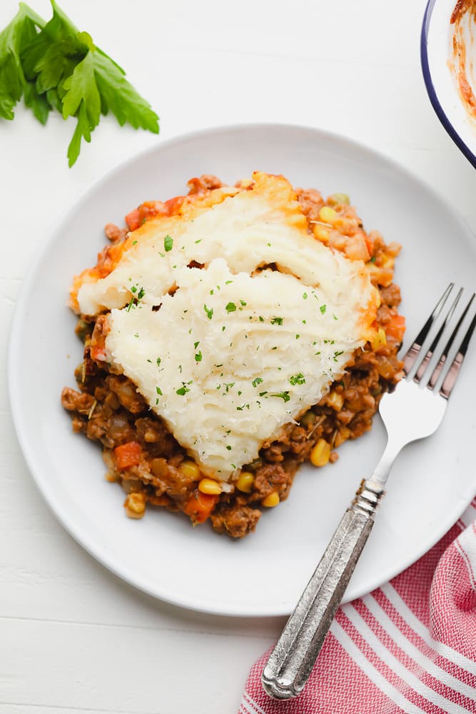 white plate with vegan shepherd's pie square