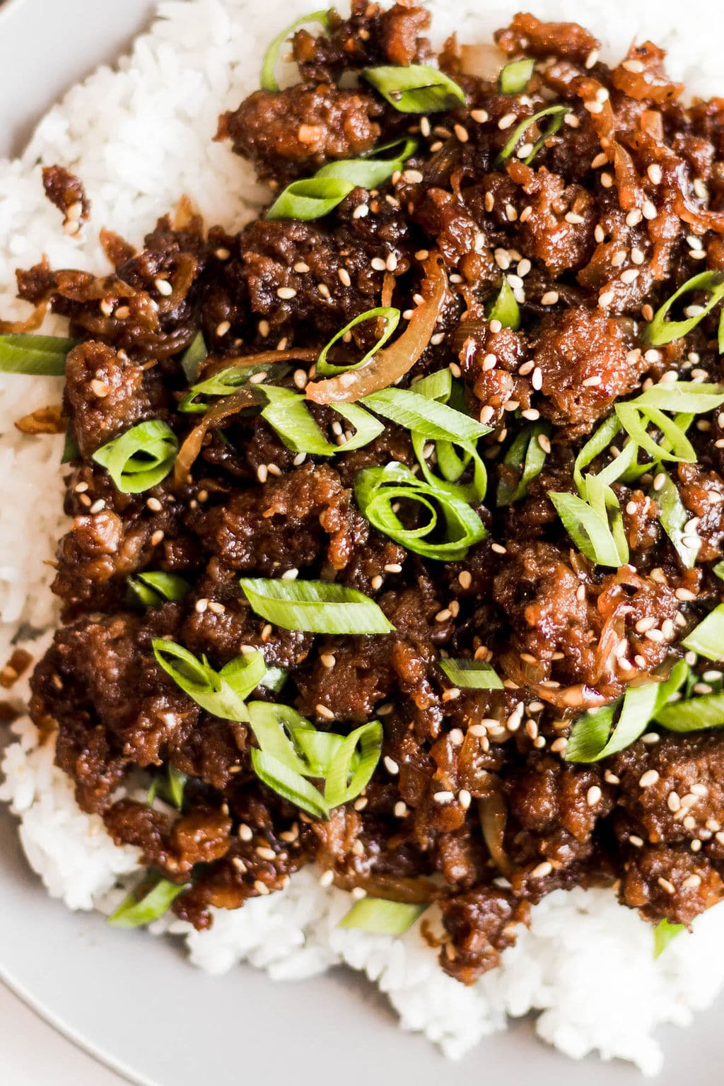 close up on cooked vegan ground beef on a pile of white rice.
