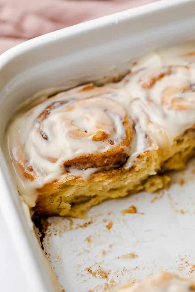 casserole dish with rolls, some taken out