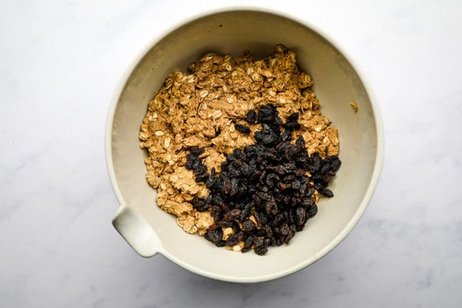 bowl with oatmeal dough and raisins added