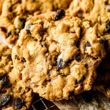 close up square image of a oatmeal raisin cookie