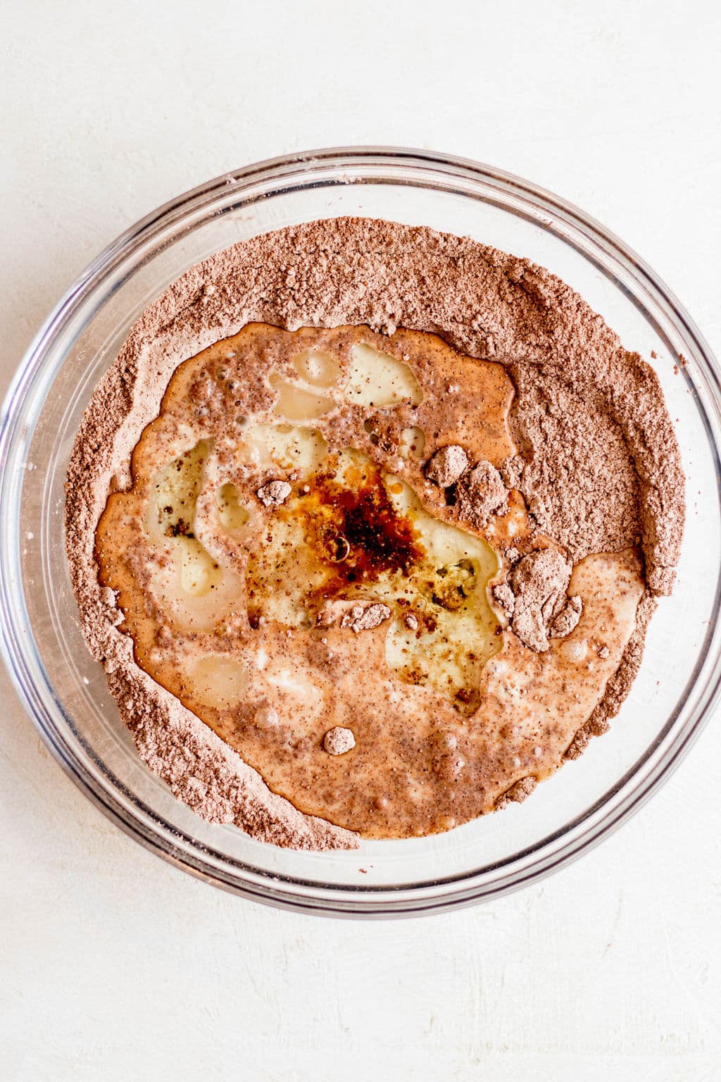 dry and wet baking ingredients together in a glass bowl.