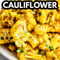 pinterest image of a pile of roasted curried cauliflower on a white plate.