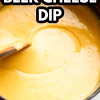 cheesy dip in pot with text overlay reading 'vegan beer cheese dip'