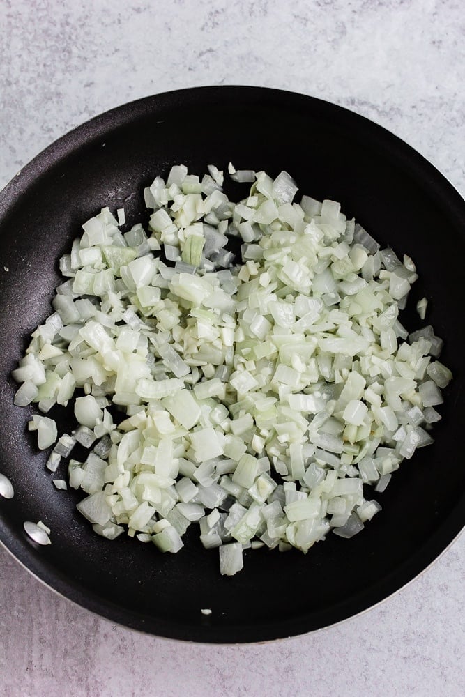 onions and garlic sauteed in a pan