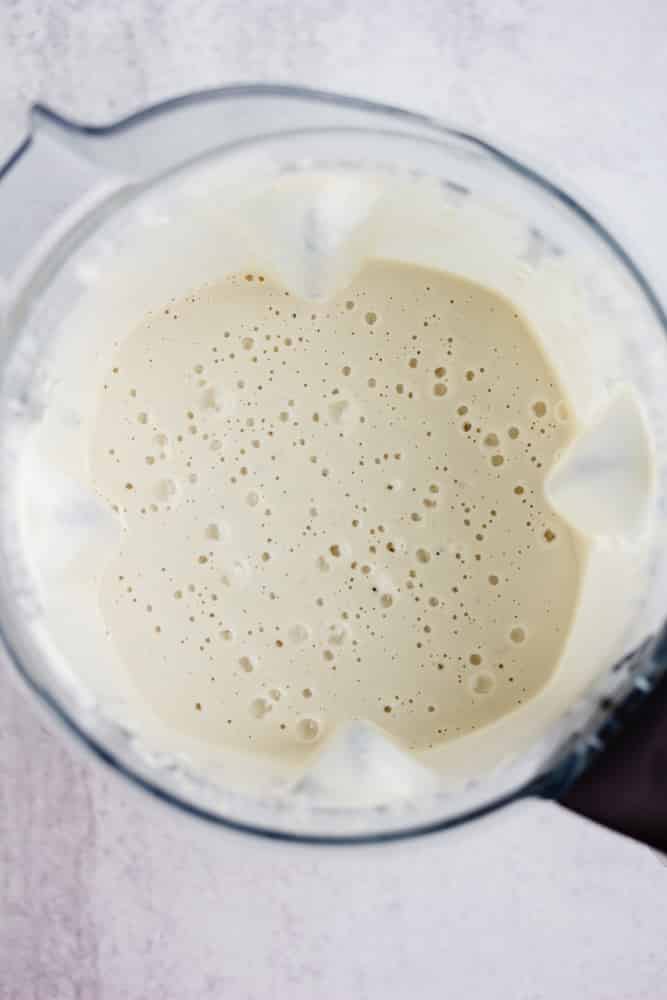 blender full of creamy blended sauce